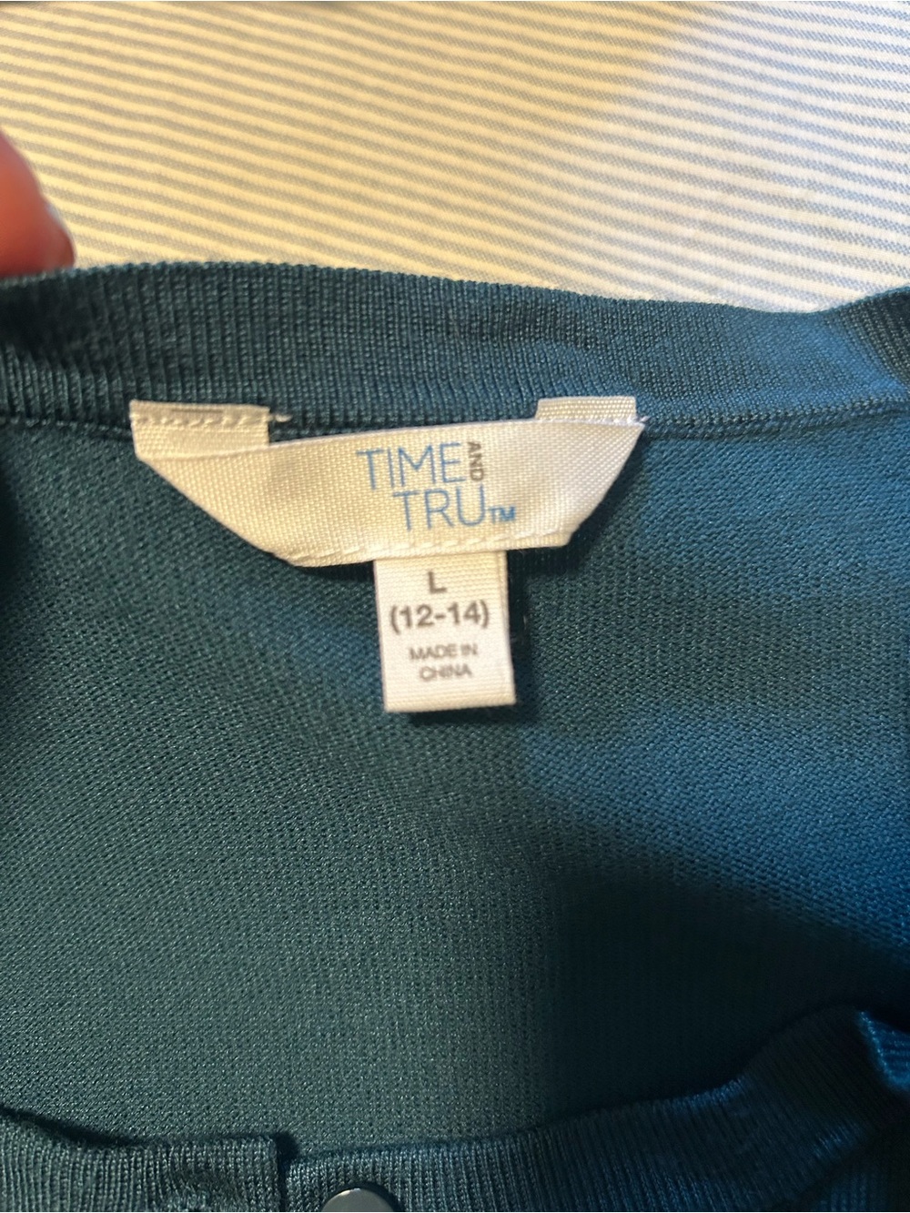 green buttoned top neckline label visible